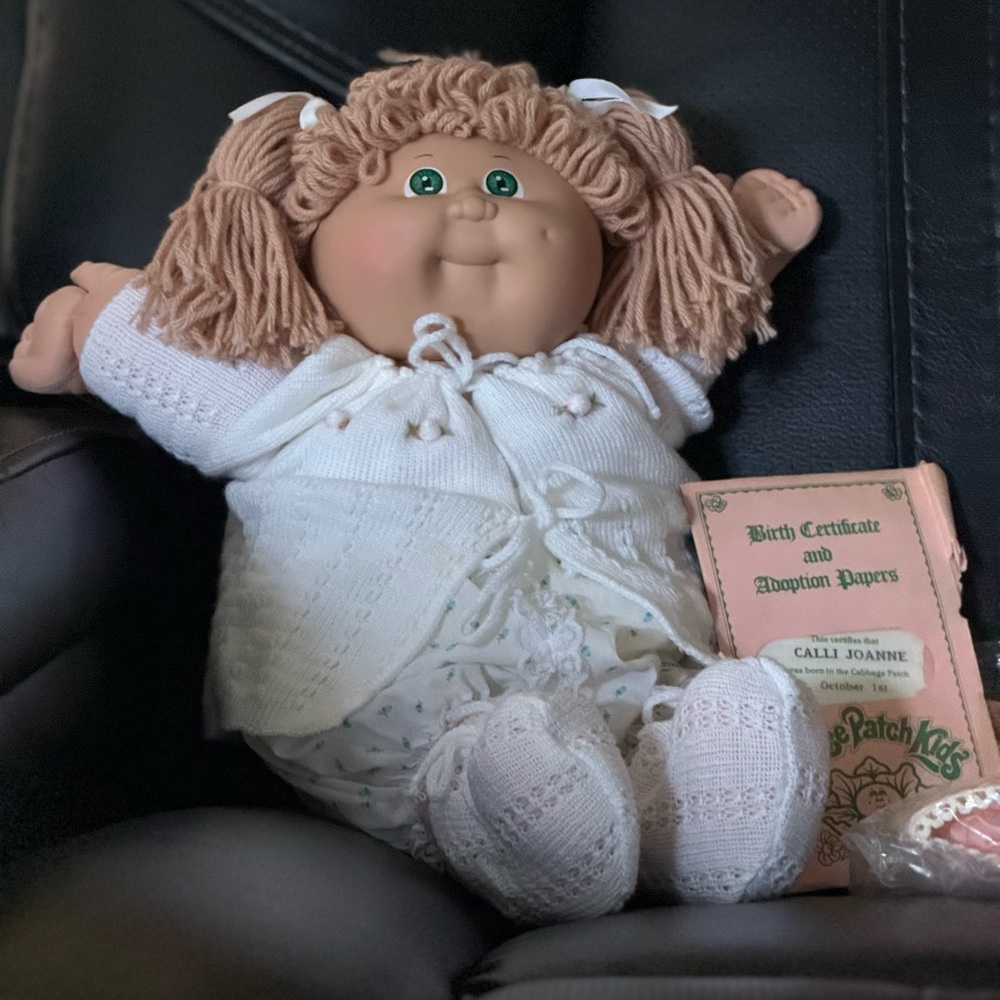 Adorable Cabbage Patch Doll with Blonde Hair and Green Eyes